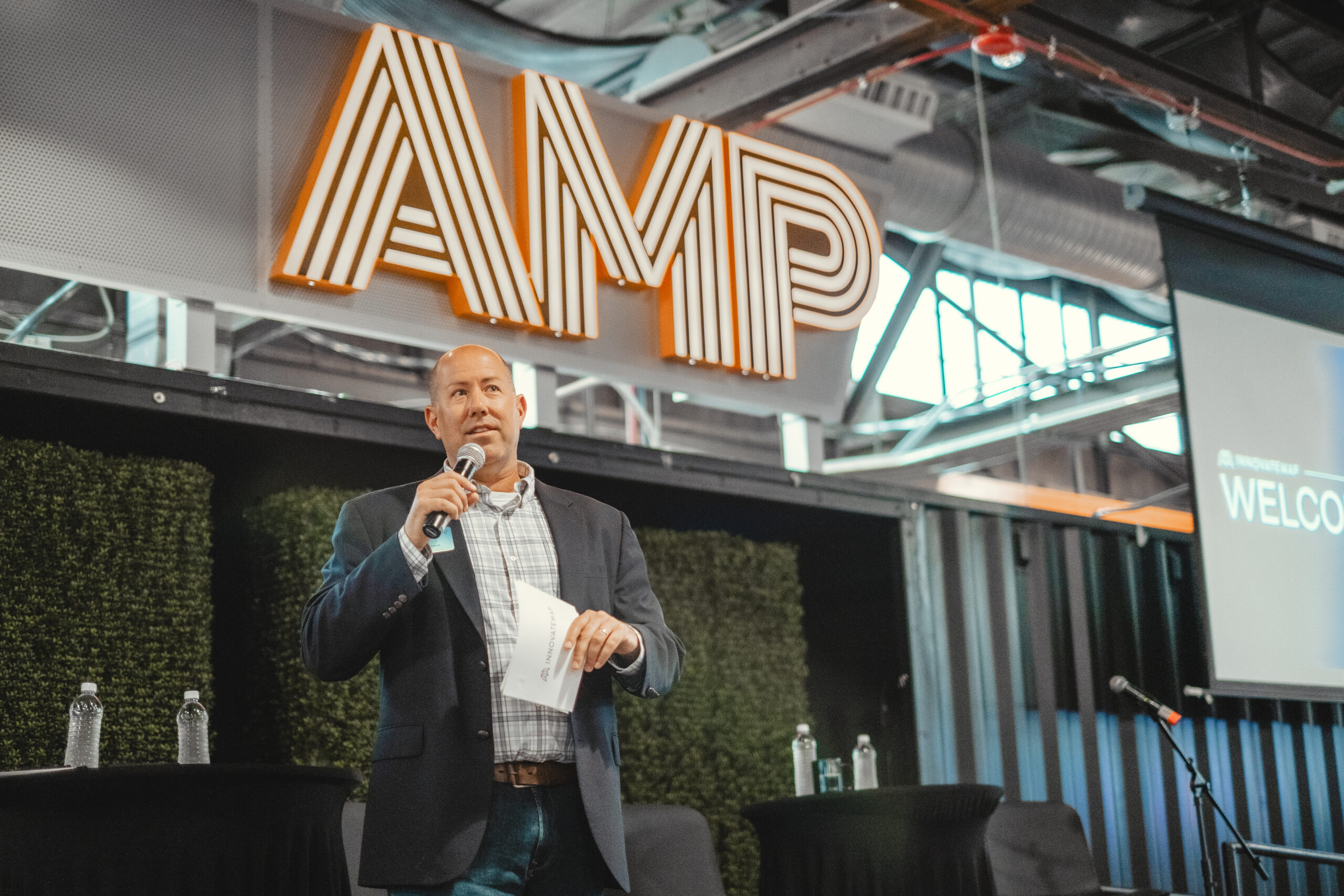 CEO Mike Reynolds welcoming founders and tech leaders to Innovatemap's event at The AMP in Indianapolis.