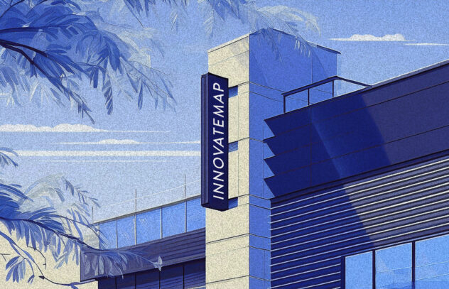 A stylized illustration of a modern building with the Innovatemap logo prominently displayed on a vertical sign. The scene is rendered in shades of blue, with tree branches framing the view in the foreground. The sky is partially cloudy, adding depth and atmosphere to the artwork.